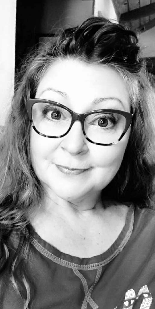 Small black and white photo of me with caption: Me, giving us ALL the do better look.